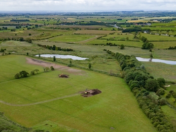 an aerial view over wetland under construction