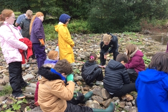 Source to sea school group surveying water