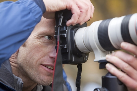 Close up of photographer with camera