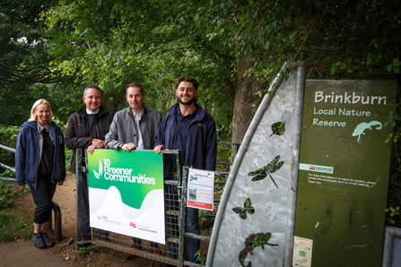 Colleagues photographed in front of entrance to Brinkburn Pond in Darlington