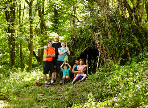 The whole family making a den in the woods