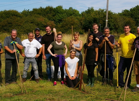 A group of corporate volunteers pictured on a break